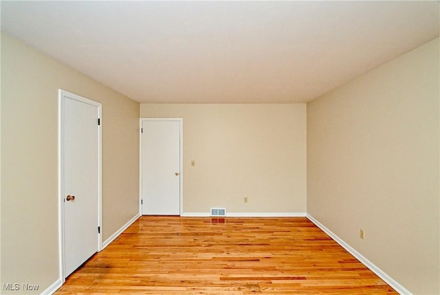 unfurnished room featuring light wood-type flooring