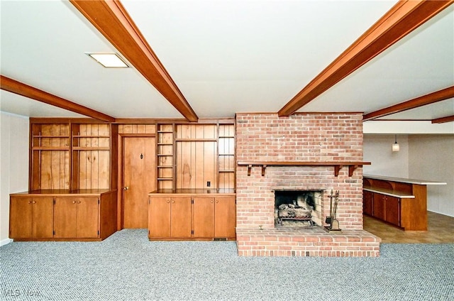 living room featuring light colored carpet, a fireplace, and beam ceiling