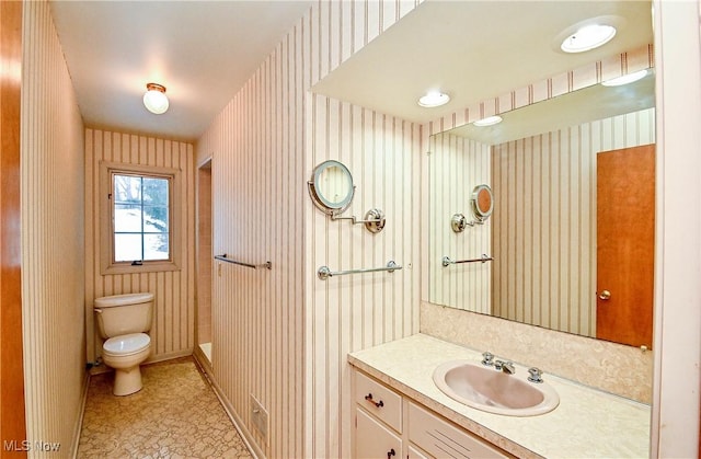 bathroom with vanity and toilet