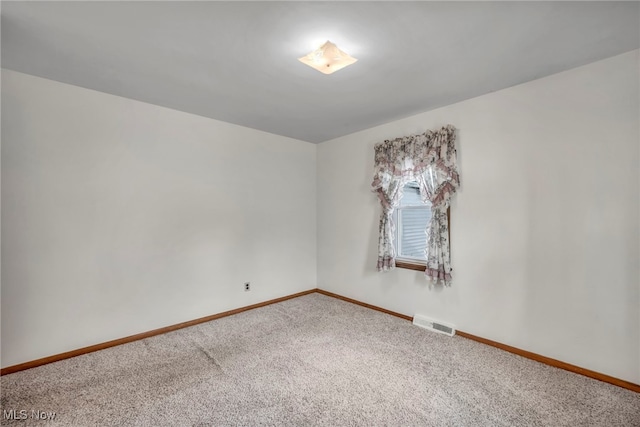 empty room featuring carpet