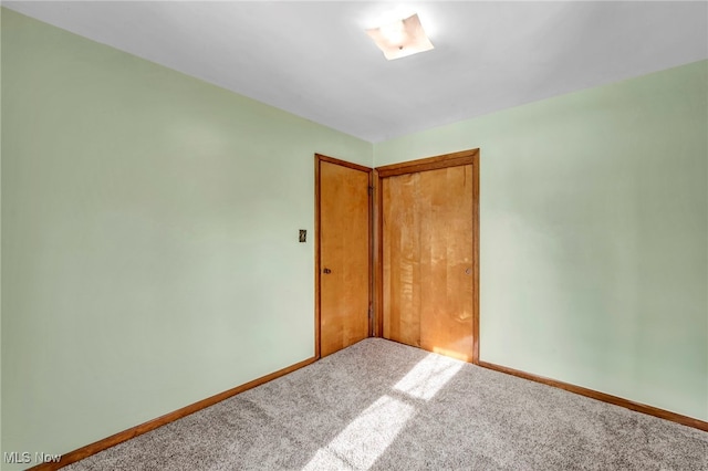 empty room featuring carpet flooring