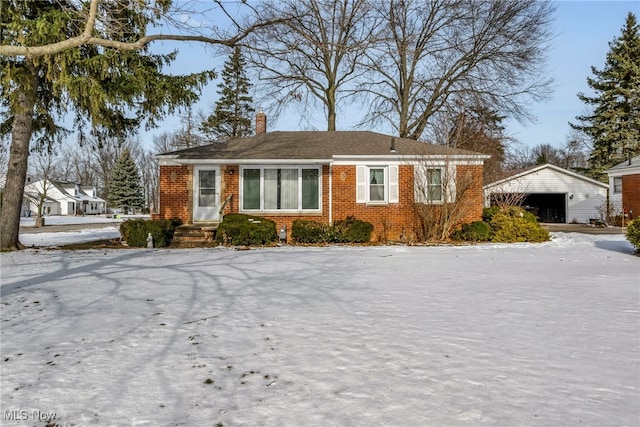 view of front of property with an outbuilding and a garage