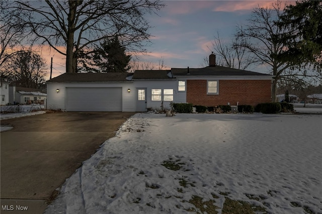 ranch-style house featuring a garage