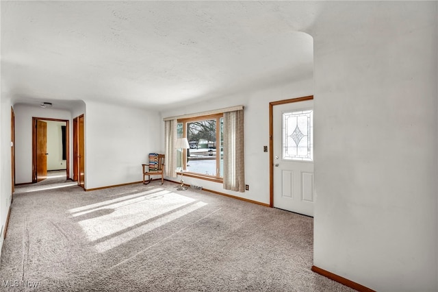 foyer featuring carpet