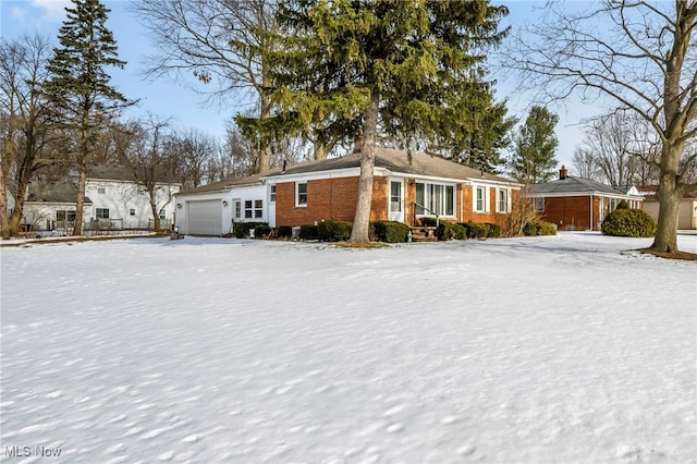 single story home featuring a garage