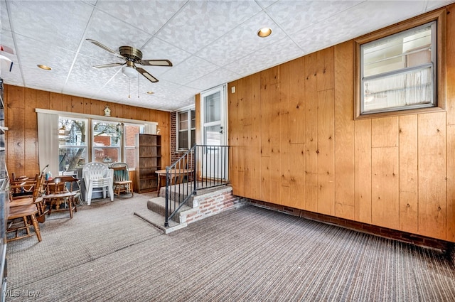 interior space featuring ceiling fan