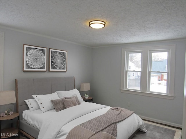 bedroom with a baseboard radiator and a textured ceiling