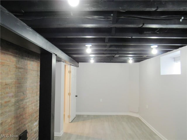 basement with light wood-type flooring