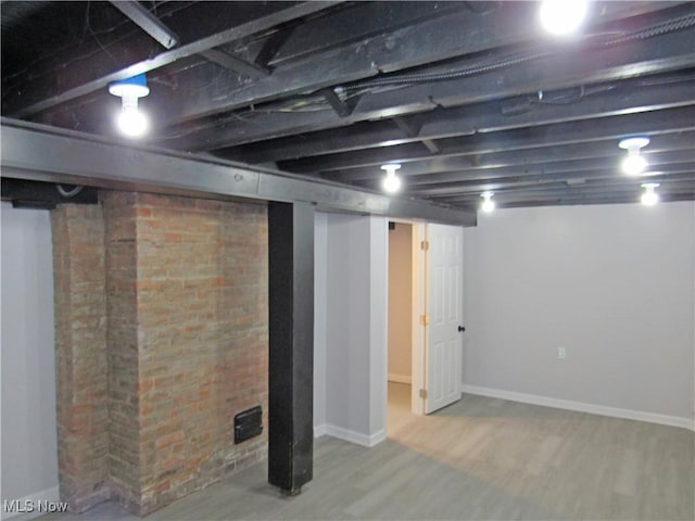 basement featuring hardwood / wood-style flooring