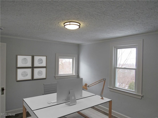 unfurnished dining area featuring ornamental molding and a textured ceiling