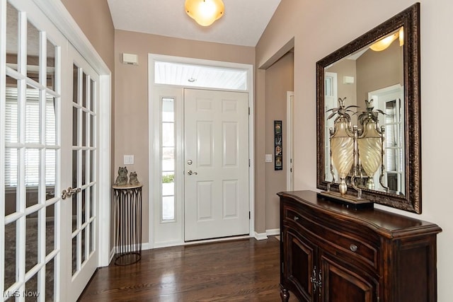 foyer entrance featuring dark wood-type flooring and french doors