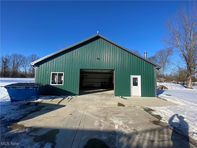 view of snow covered garage