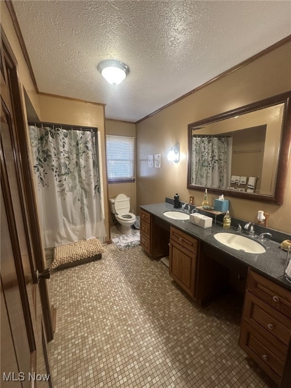 bathroom featuring tile patterned flooring, vanity, a textured ceiling, and toilet