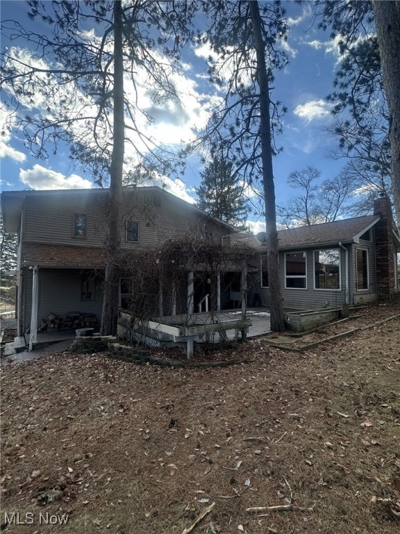 back of house with a patio