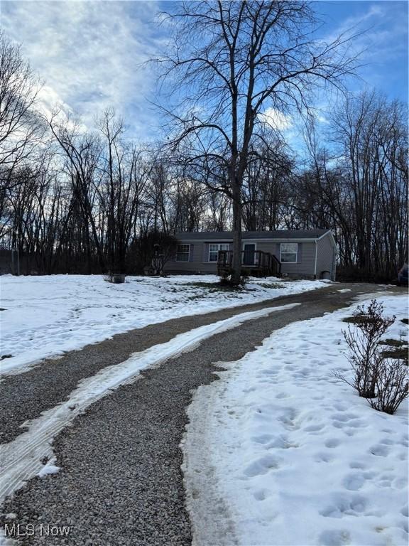 view of yard layered in snow