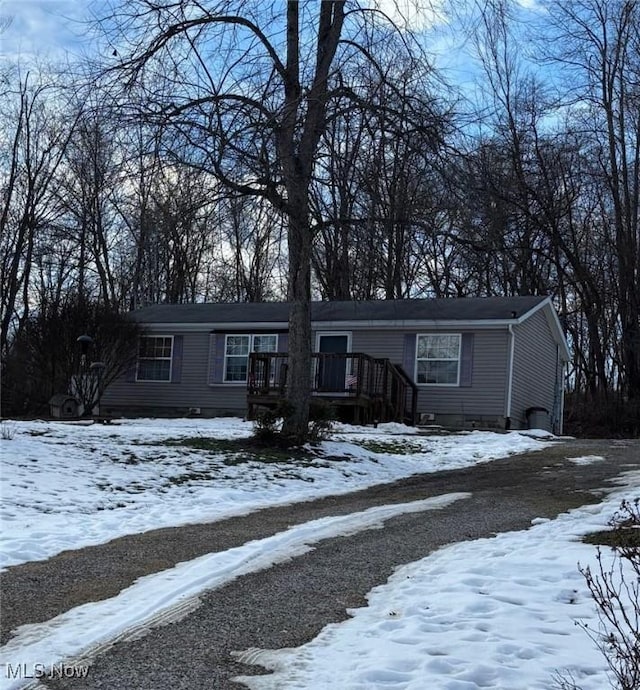 view of front of property with a wooden deck