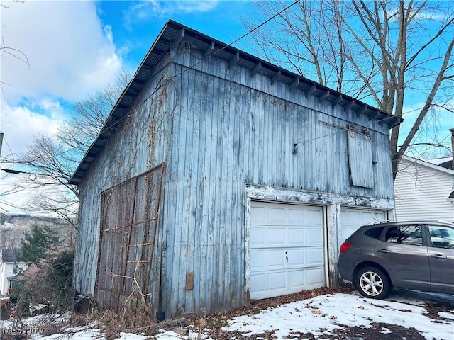 view of snow covered garage