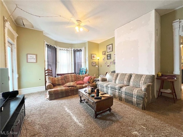 carpeted living room with ceiling fan