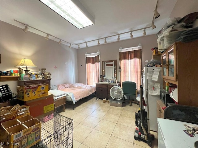 bedroom featuring light tile patterned floors