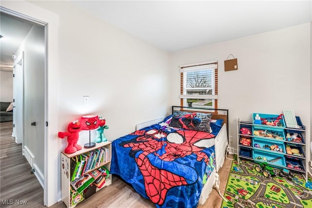 bedroom featuring hardwood / wood-style floors