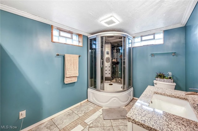 bathroom with vanity, ornamental molding, shower / bath combination with glass door, and a healthy amount of sunlight