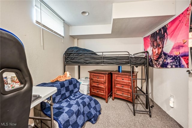 bedroom featuring light carpet