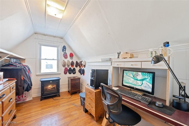 office featuring lofted ceiling and light hardwood / wood-style floors