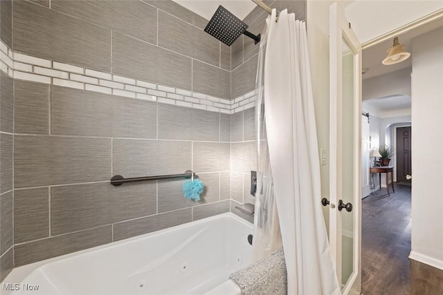 bathroom featuring hardwood / wood-style flooring and shower / tub combo