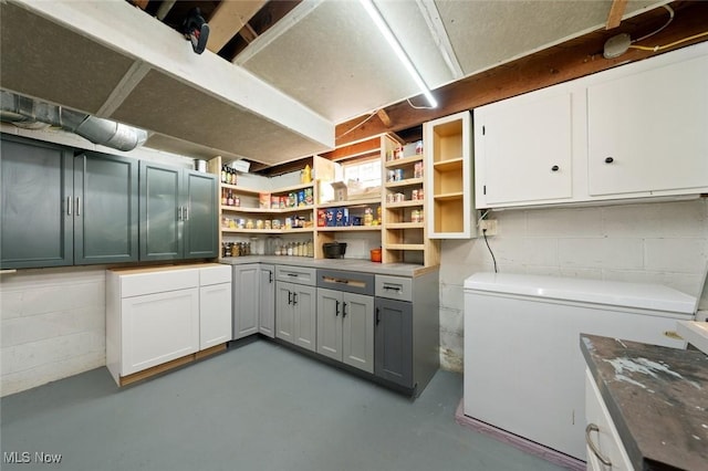 basement featuring refrigerator