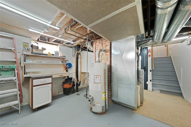 basement featuring heating unit and gas water heater