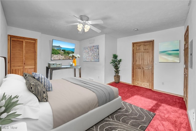 bedroom with carpet floors, a closet, and ceiling fan