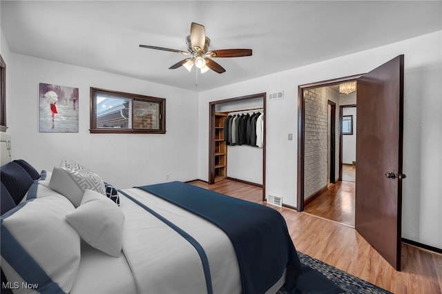 bedroom featuring a closet, ceiling fan, and light hardwood / wood-style flooring