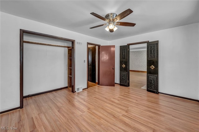 unfurnished bedroom with ceiling fan, a closet, and light hardwood / wood-style flooring