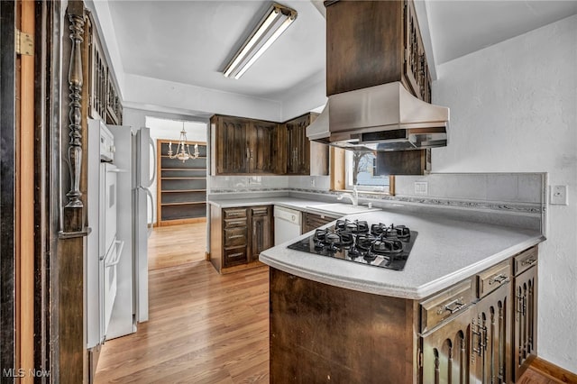 kitchen featuring sink, light hardwood / wood-style flooring, dark brown cabinetry, gas stovetop, and white dishwasher