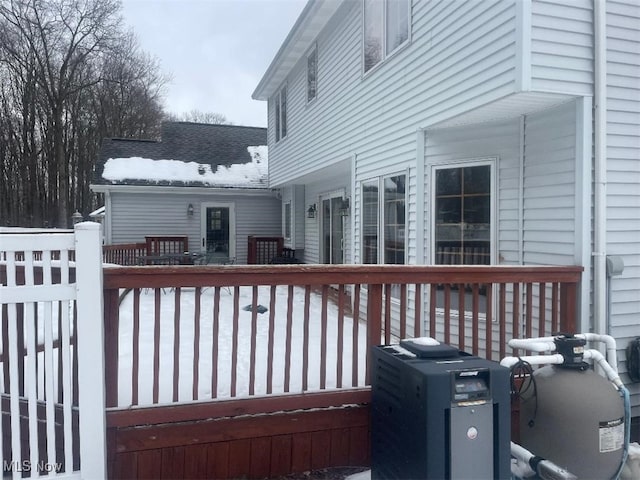 view of snow covered deck