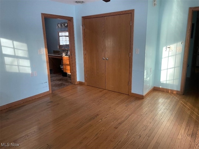 interior space featuring a closet and light hardwood / wood-style flooring