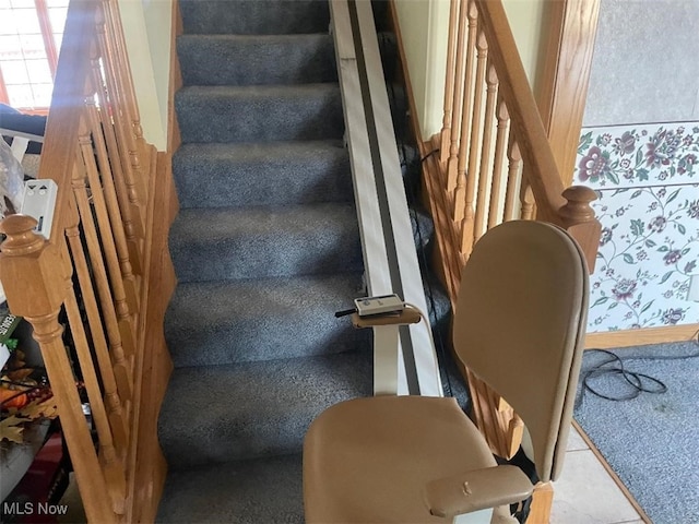 stairway with tile patterned floors