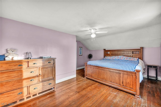 bedroom featuring lofted ceiling, dark hardwood / wood-style floors, and ceiling fan