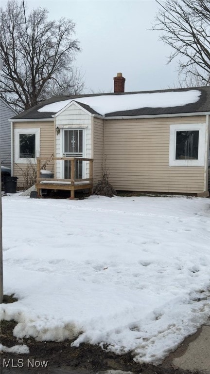 view of snow covered house