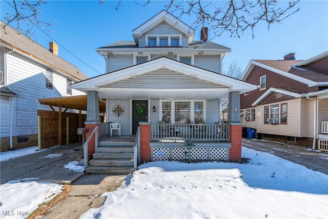 view of front of house featuring cooling unit and covered porch