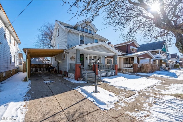 front of property with a carport and a porch