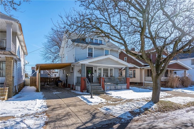 view of front of property featuring a carport and covered porch