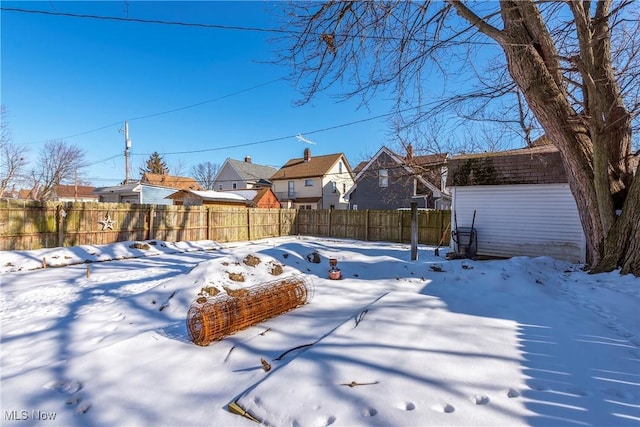 view of yard layered in snow