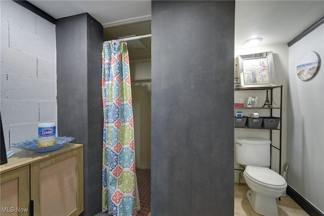 bathroom with walk in shower, tile patterned floors, and toilet