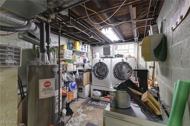 washroom featuring water heater and washer and dryer