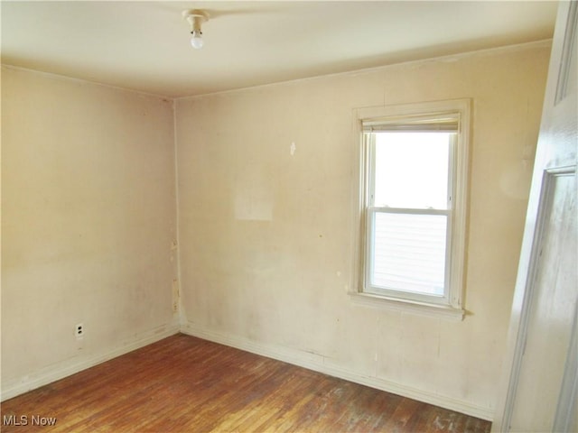 empty room with wood-type flooring