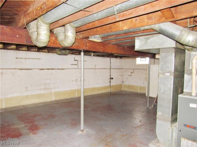 basement featuring heating unit