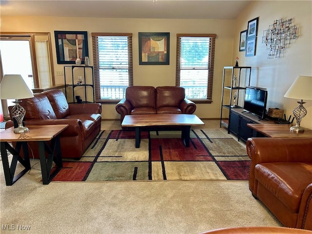 carpeted living room with vaulted ceiling