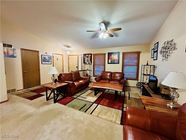 living room with vaulted ceiling, carpet flooring, and ceiling fan