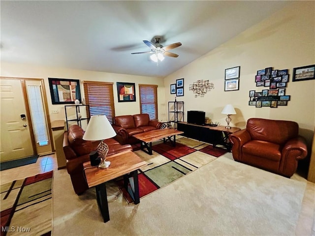 tiled living room with vaulted ceiling and ceiling fan